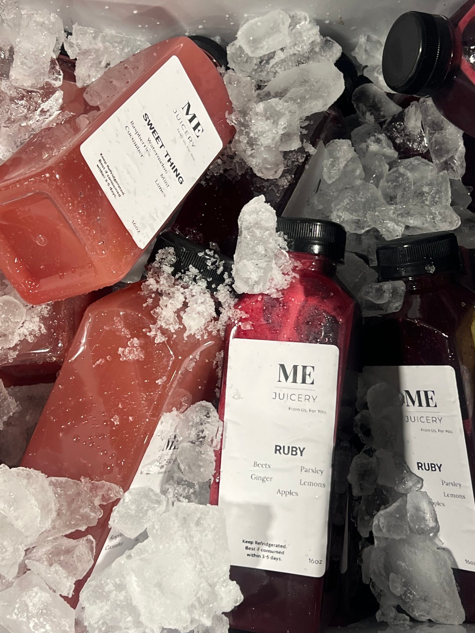 ME Juicery cold-pressed juices chilled on ice