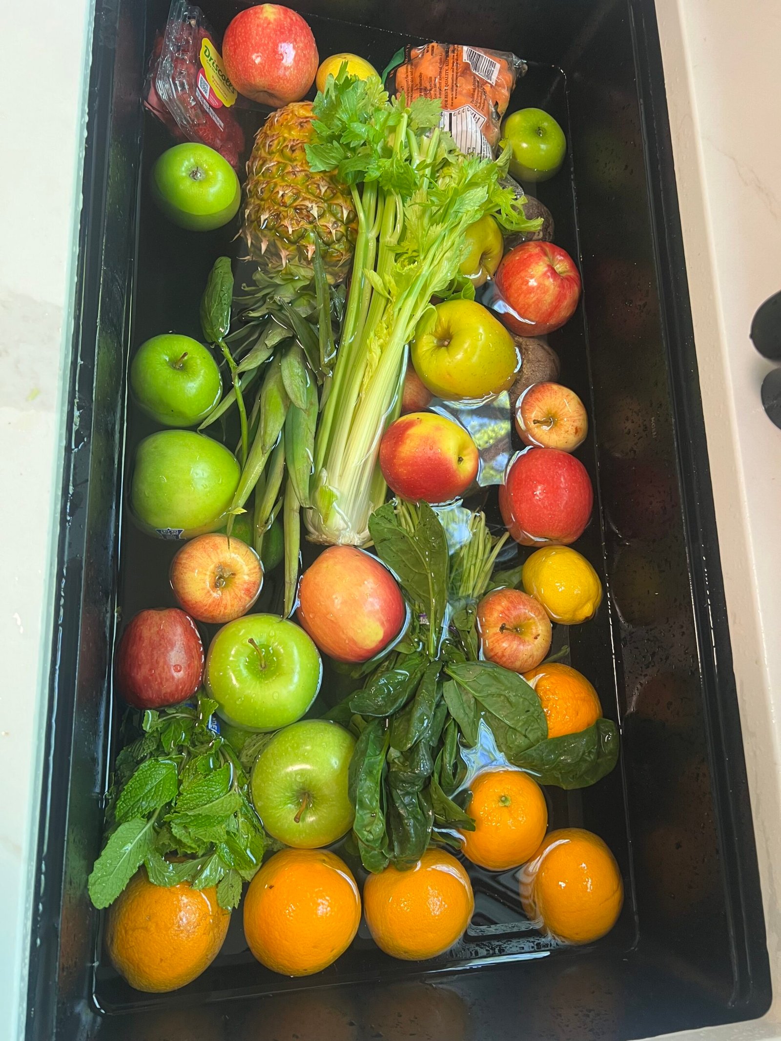 Fresh produce soaking before juicing